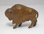 Click to view Antique Buffalo Cast Iron Penny Still Bank photos