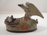 Click to view Eagle and Eaglets Cast Iron Mechanical Bank photos