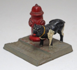 Click to view Dog Cocking Leg on Fire Hydrant Paperweight  photos